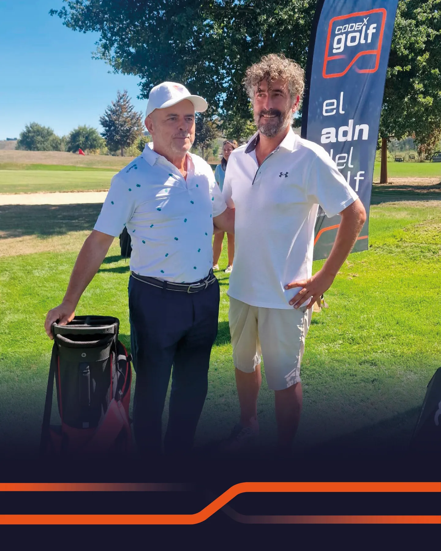 Two players pose with their prize next to the Codex Golf banner