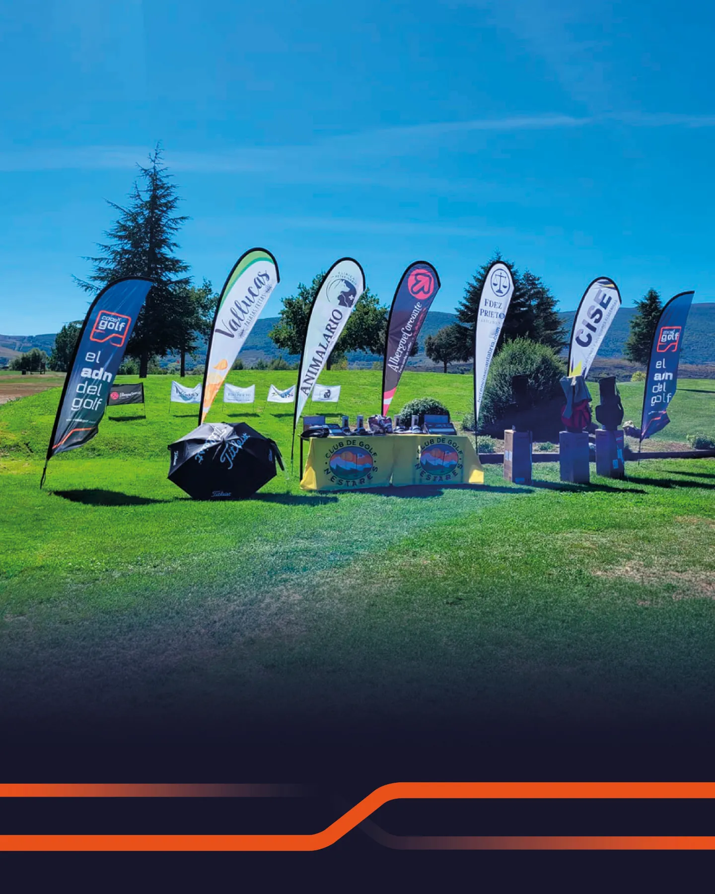 Sponsor banners and the prize table at the Club de Golf Nestares tournament